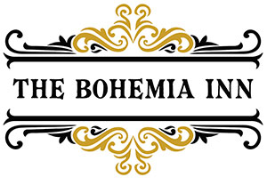 Ornate scroll inspired sign logo in black and gold with text that reads: The Bohemia Inn.